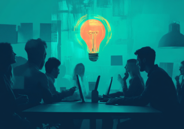 AI Generated image of people sitting around a table in an office with laptops, smiling, and a large light bulb in the space above their heads.